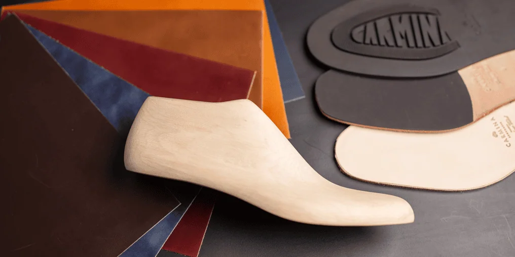 Wooden shoe last, leathers and soles in the Carmina Shoemaker workshop